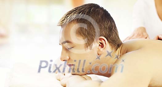 Man enjoying a massage Man enjoying a massage