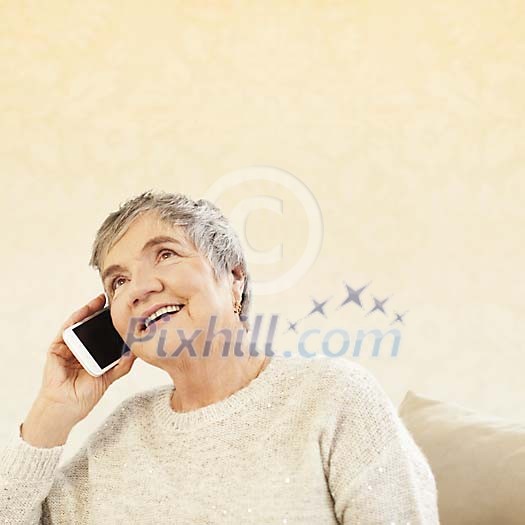 Older female talking to a phone Older female talking to a phone