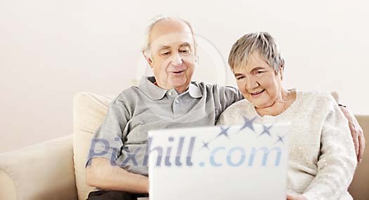 Older couple with a laptop Older couple with a laptop
