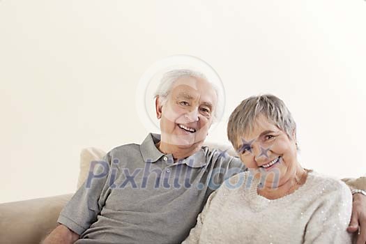 Older couple sitting on the sofa Older couple sitting on the sofa