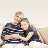 Girl with older woman on the sofa