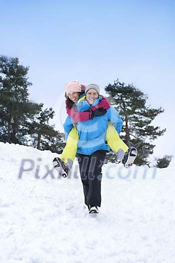 Couple having fun in the snow Couple having fun in the snow