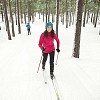 Woman skiing in the forest