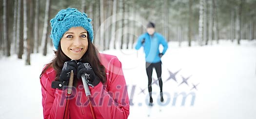 Woman skiing in the forest