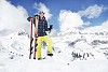 Woman standing on top of the snowy mountain