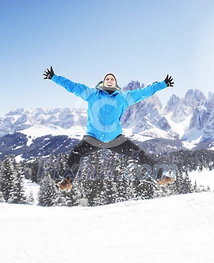 Happy man jumping in the snow Happy man jumping in the snow