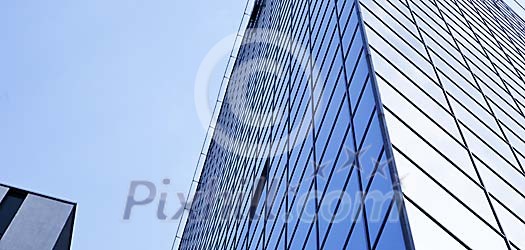 Glass facade of a tall building Glass facade of a tall building