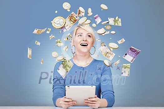 Woman sitting by her desk surrounded by flying money Woman sitting by her desk surrounded by flying money
