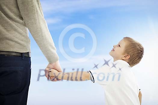 Boy walking with his father Boy walking with his father