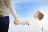 Boy walking with his father