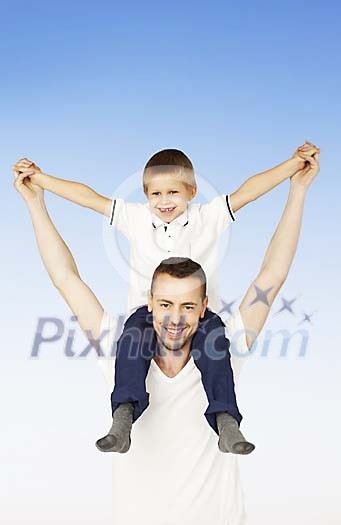 Happy boy on his fathers shoulders Happy boy on his fathers shoulders