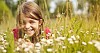 Girl hiding in the meadow