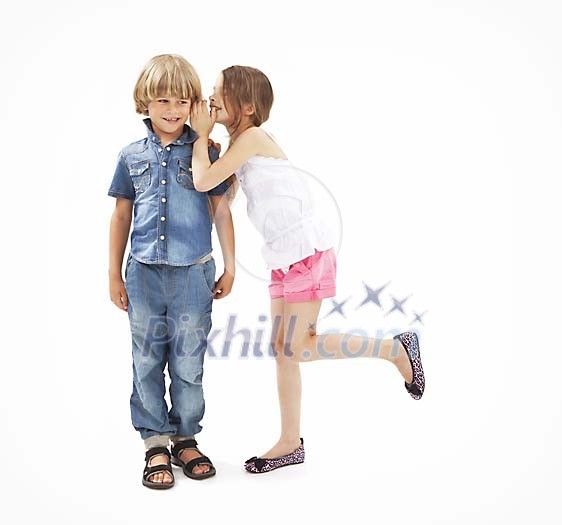 Isolated girl whispering in to a boys ear Isolated girl whispering in to a boys ear