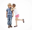 Isolated girl whispering in to a boys ear