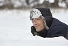 Smiling man dreaming in snow