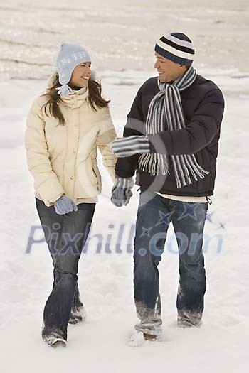 Couple walking outside in winter Couple walking outside in winter