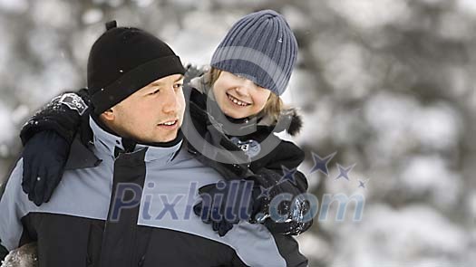 Man carrying his son on his back Man carrying his son on his back