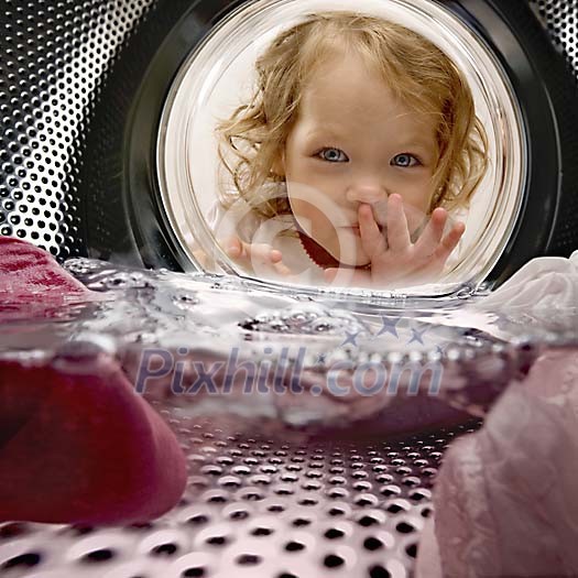 Girl looking through the washbasin window