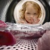 Girl looking through the washbasin window