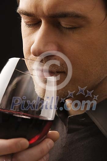 Man smelling red wine Man smelling red wine