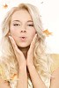Pretty woman with goldfishes