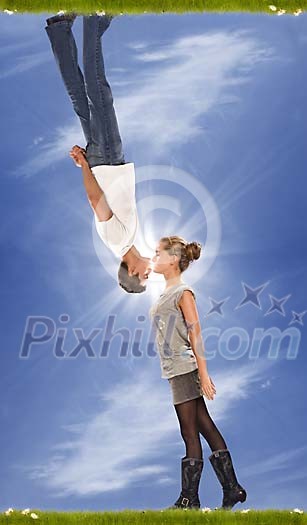 Upside down man kissing a woman Upside down man kissing a woman