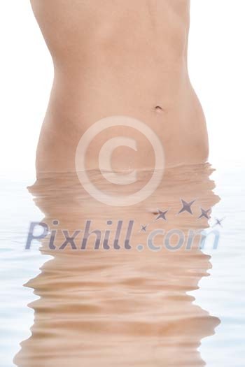 Flat womans stomach in the water