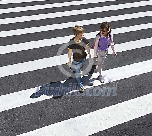 Children walking on the crosswalk Children walking on the crosswalk