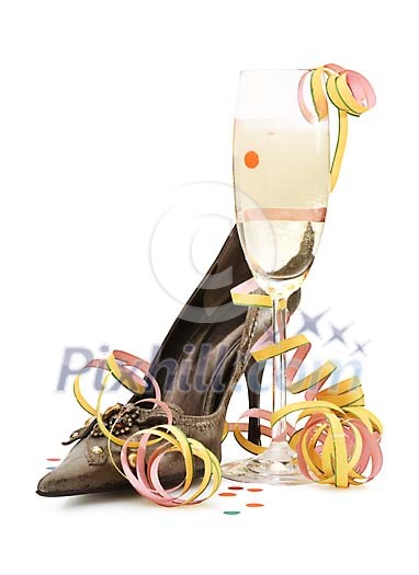 Isolated high heel shoe with a champagne glass and serpentine Isolated high heel shoe with a champagne glass and serpentine