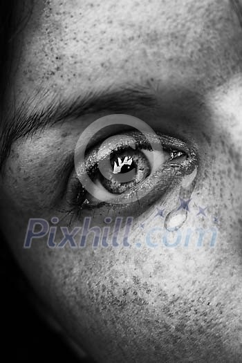 Close-up of an eye with tear Close-up of an eye with tear