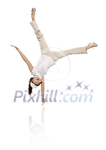 Young woman balancing on one finger Young woman balancing on one finger