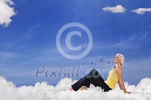 Young woman sitting on clouds Young woman sitting on clouds