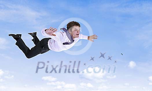 Businessman flying in the sky conceptual Businessman flying in the sky conceptual