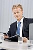 Young business man behind his desk