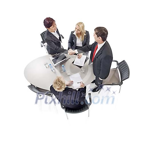 Business meeting around table shot from above Business meeting around table shot from above