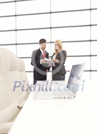Business persons in a modern meeting room Business persons in a modern meeting room