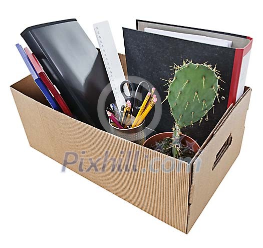 Office desk items in cardboard box