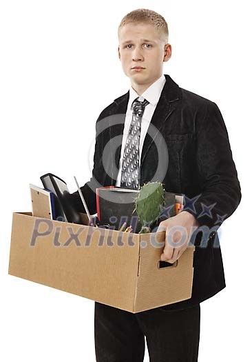 Sacked employee carrying a box with office supplies Sacked employee carrying a box with office supplies