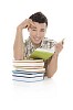 Boy behind a pile of books isolated on white