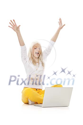 Blonde girl cheering behind a laptop Blonde girl cheering behind a laptop