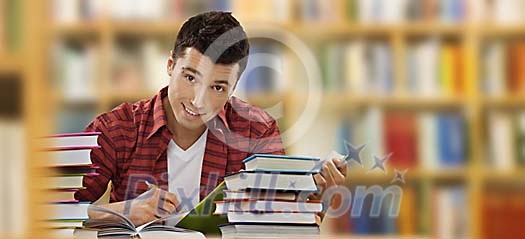 Teenager boy studying in library Teenager boy studying in library