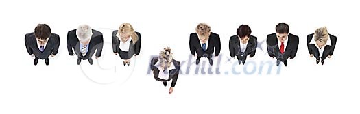 Businesswoman stepping out from a row of business people Businesswoman stepping out from a row of business people