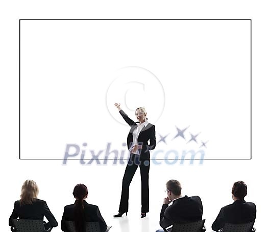 Business woman giving a presentation in front of an empty billboard Business woman giving a presentation in front of an empty billboard