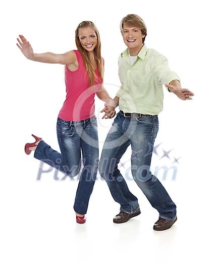 Young couple dancing and smiling on white Young couple dancing and smiling on white