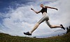 Wide-angle view of a female jogger