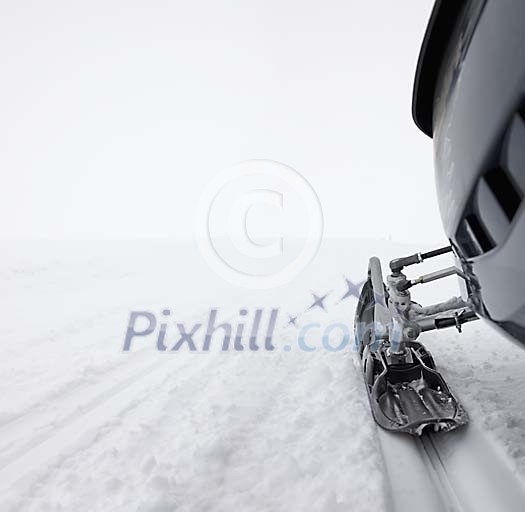 Snowmobile foot in the snow Snowmobile foot in the snow