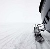 Snowmobile foot in the snow