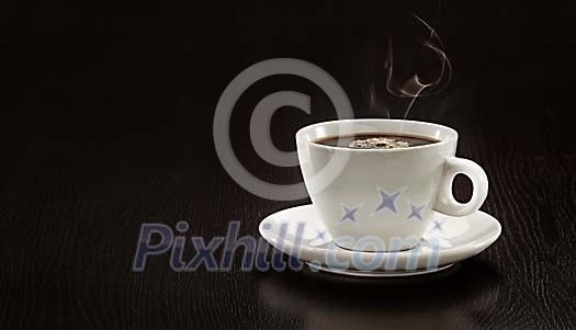 Lonely coffee cup on a dark table