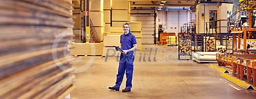 Man standing in big warehouse Man standing in big warehouse