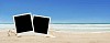 Two polaroids on a sandy beach